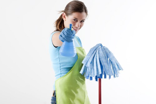 After builders cleaning team removing renovation dust in a SE17 property