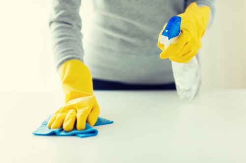 Carpet cleaning worker managing safe manual handling